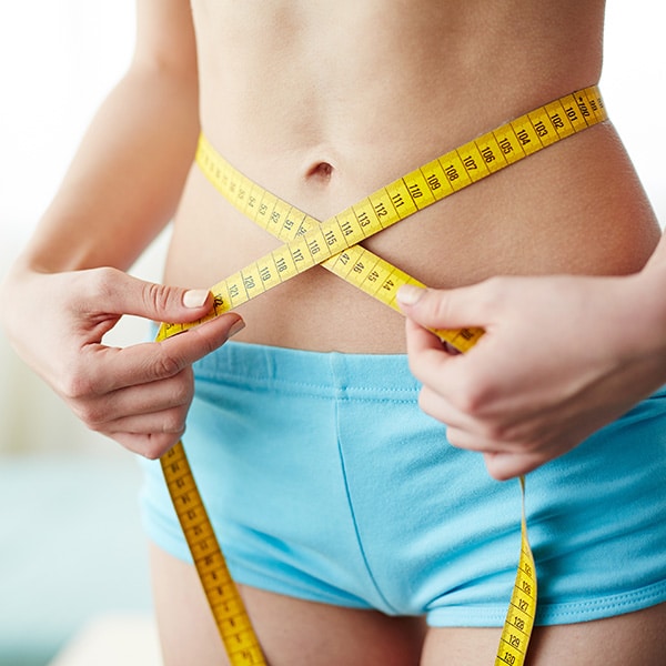 Semaglutide-Medi-Weight-Loss-Main-Photo Tape measure around body showing results of Semaglutide peptide therapy for medical weight loss
