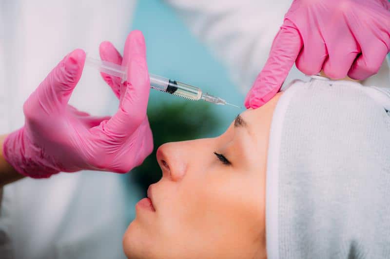 Medical aesthetic cosmetic injectables Fort Myers Naples Woman being treated with Medical aesthetic cosmetic injectables