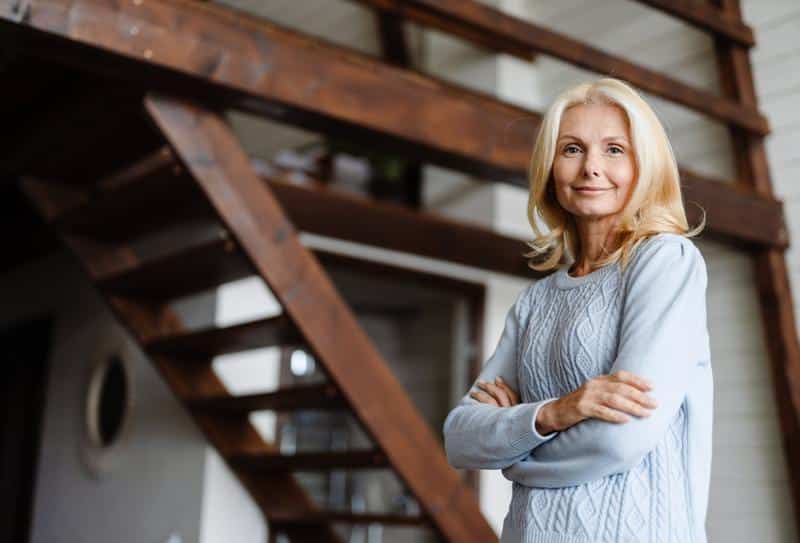 a happy middle-aged woman after undergoing the latest menopause treatment