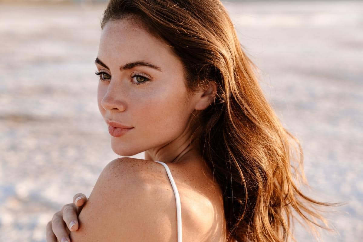 bellafill-dermal-filler-results-fort-myers-naples a woman on the beach showing the smooth skin you can get after bellafill treatment in fort myers or naples, fl