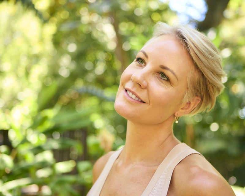smiling-woman-after-daxxify-treament-for-frown-lines-naples-fort-myers a woman smiling after daxxify treatment for frown lines in Naples and Fort Myers, FL